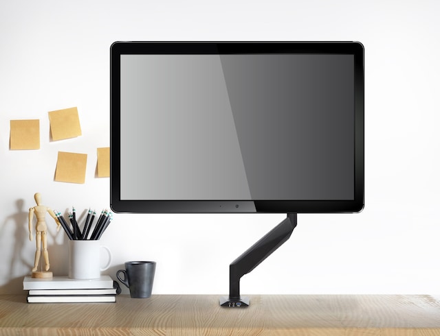Gasarm with monitor mounted on desk